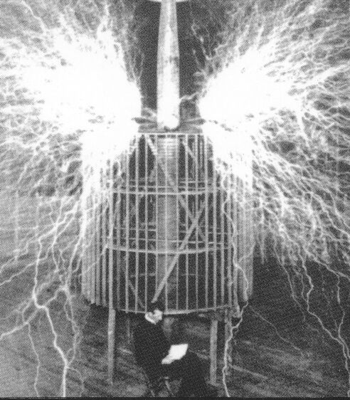 Double exposure of Nikola Tesla and one of his operating coils.